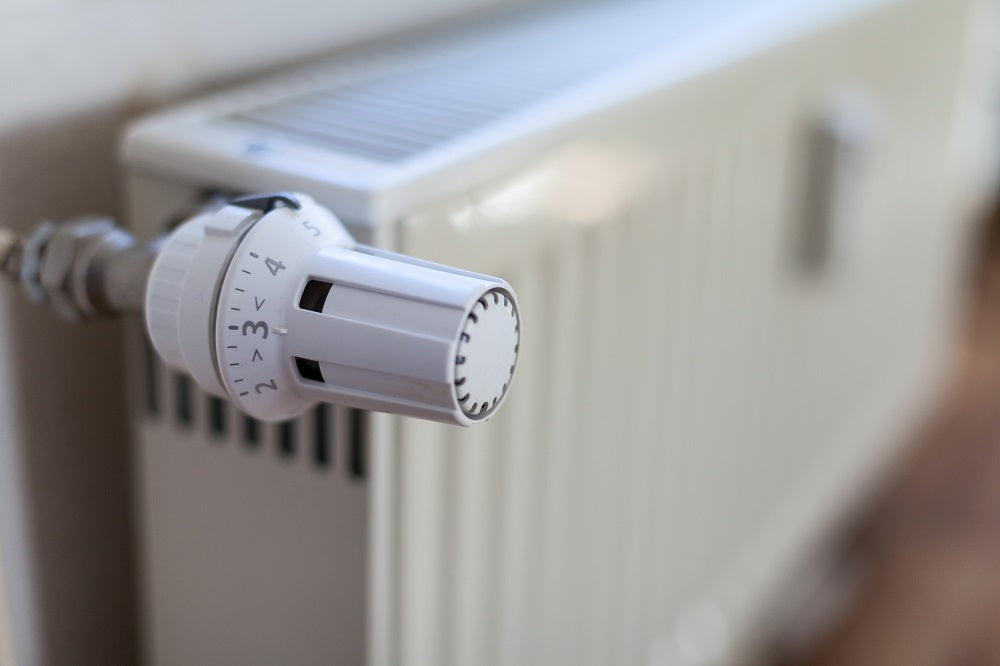 How do heat exchangers support the operation of radiators?